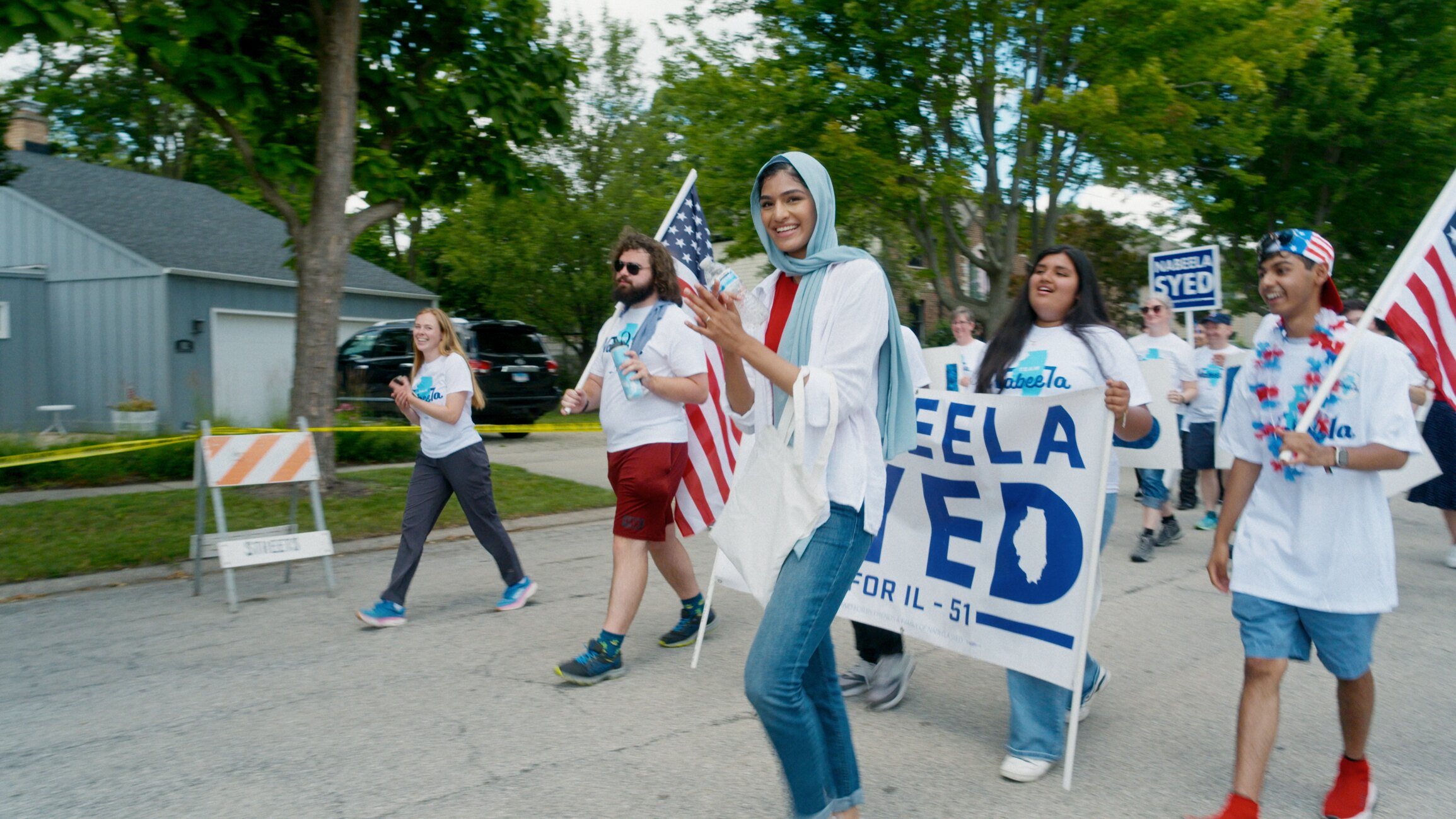 Nabeela Syed with community members in a still from Seat at the Table